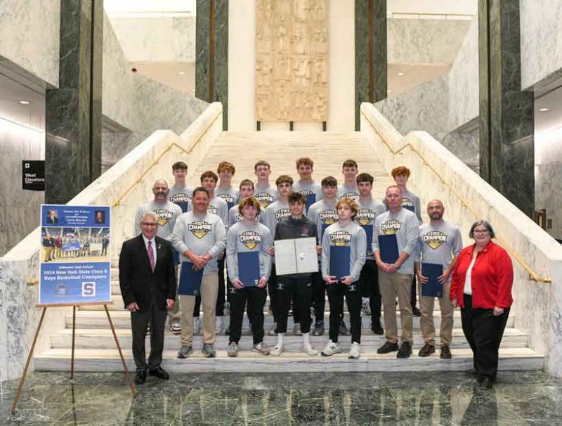 Senator Jim Tedisco and Assemblywoman Carrie Woerner pose with the Class B state champion Stillwater High School boys basketball team. Photo provided by Adam Kramer.