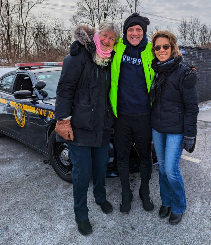 Glenville Rotary Beth Kissinger, veteran Jimmy Thomas and Shirley Gawlak after Thomas completed his Doggie Paddle marathon on Feb. 4.  Photo by Sue Clark Photography.