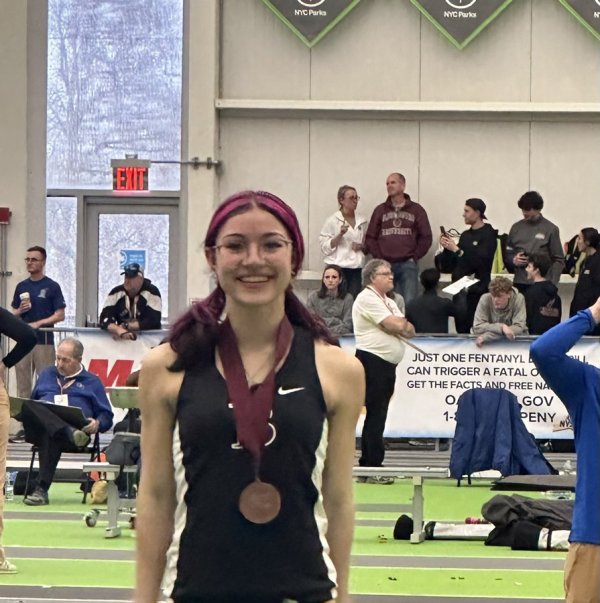 Ballston Spa’s Gabby Bozeth poses with her medal after finishing 5th in the girls’ 300-meter dash at the NYSPHSAA indoor track and field championships. Photo provided by Director of Coaching Gary Preece.