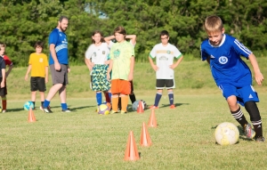 Under the watchful eye of Coach Rob Kelly, the Saratoga Wilton 12U Soccer team works on their skills in preparation for their friendly matches in Ireland