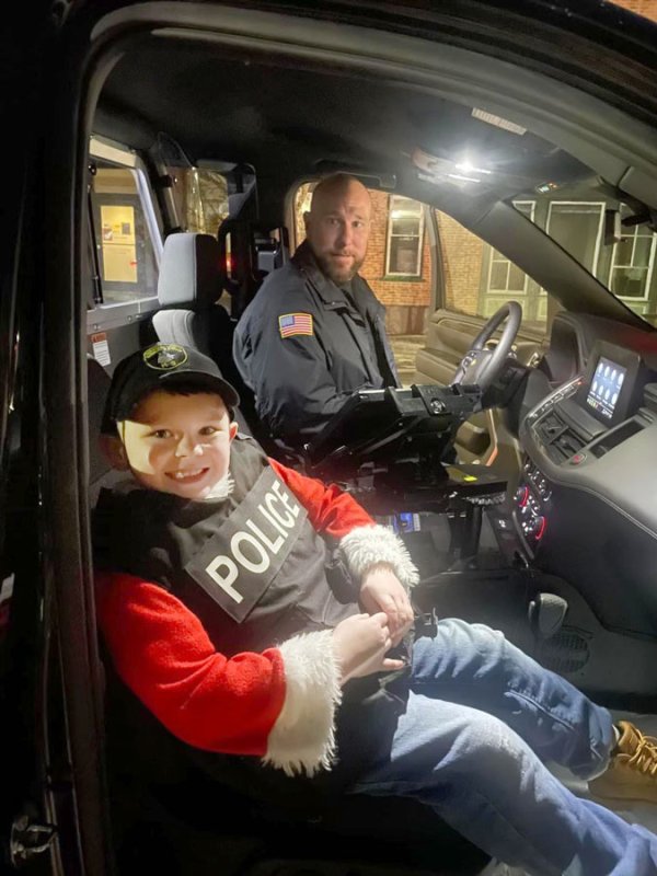  Aidan McFarland was given a ride in a police car after donating breakfasts and dinners to local police on Christmas Eve and Christmas. Photo provided. 