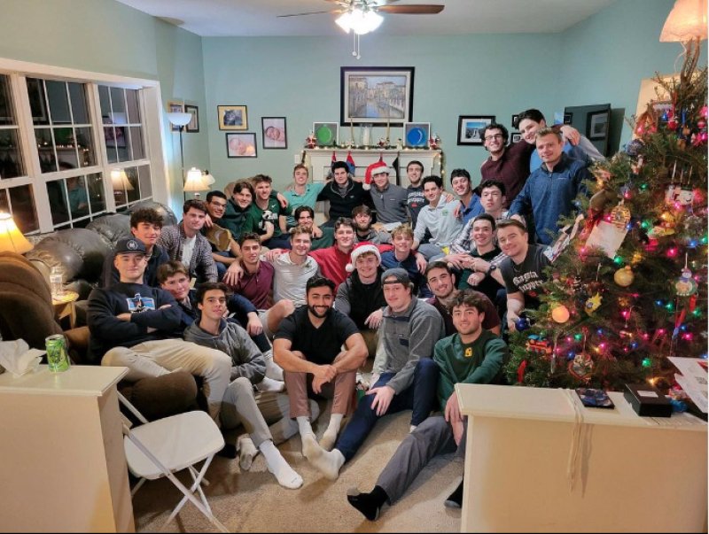 The Skidmore baseball team poses during a holiday dinner last year hosted by Coach Ron Plourde.  Photo via @skidmorebaseball Instagram.  