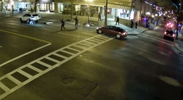 Video capture from city camera at 3:03 a.m. on Sunday, Nov. 20, 2022 depicting officers on the west side of Broadway near Caroline Street tending to scene of weekend shooting. Snapshot of a 2-minute video officially released by the city on Nov. 20. A 26-second video from an officer’s body cam was also released.