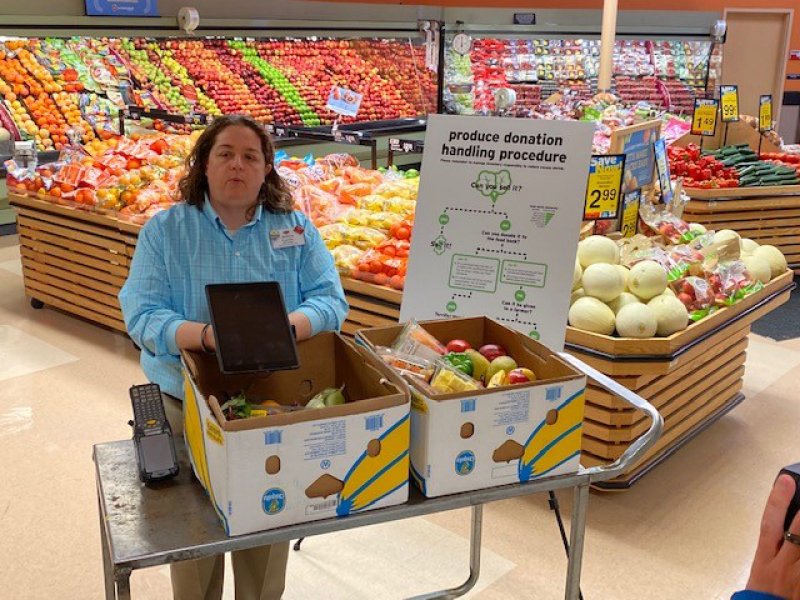 Hannaford Supermarkets Store Manager Jessica Cucchi discusses the retailer’s strategic product ordering and management process at the Hannaford location at 900 Central Ave. in Albany, on April 20. The process is part of a multi-pronged approach by Hannaford to donate or divert all food at risk of going to waste. Photo provided.