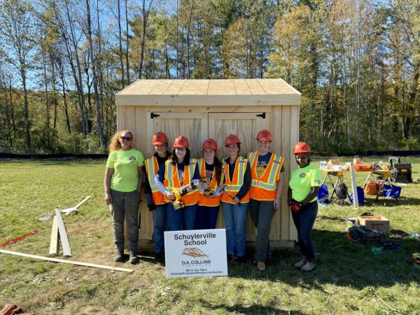 Students from Schuylerville School worked with women from D.A Collins to complete their shed during the build-a-thon. All six sheds are up for auction with proceeds benefitting three local charities.