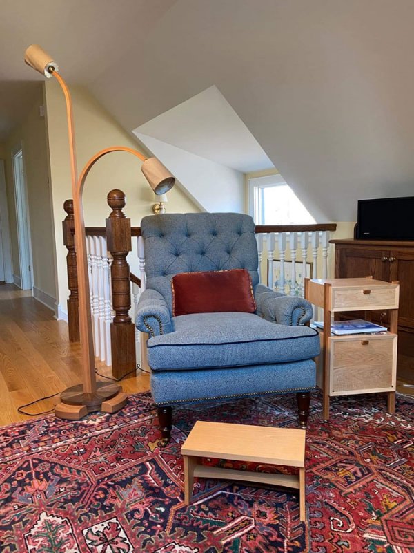 The wood floor lamp, side table, and stool pictured here were all completed by John Haller, the owner of Saratoga Joinery, a new woodworking workshop opening in downtown Saratoga Springs. 